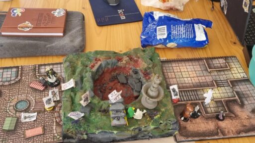 The physical terrain and miniatures make the game world more tangible